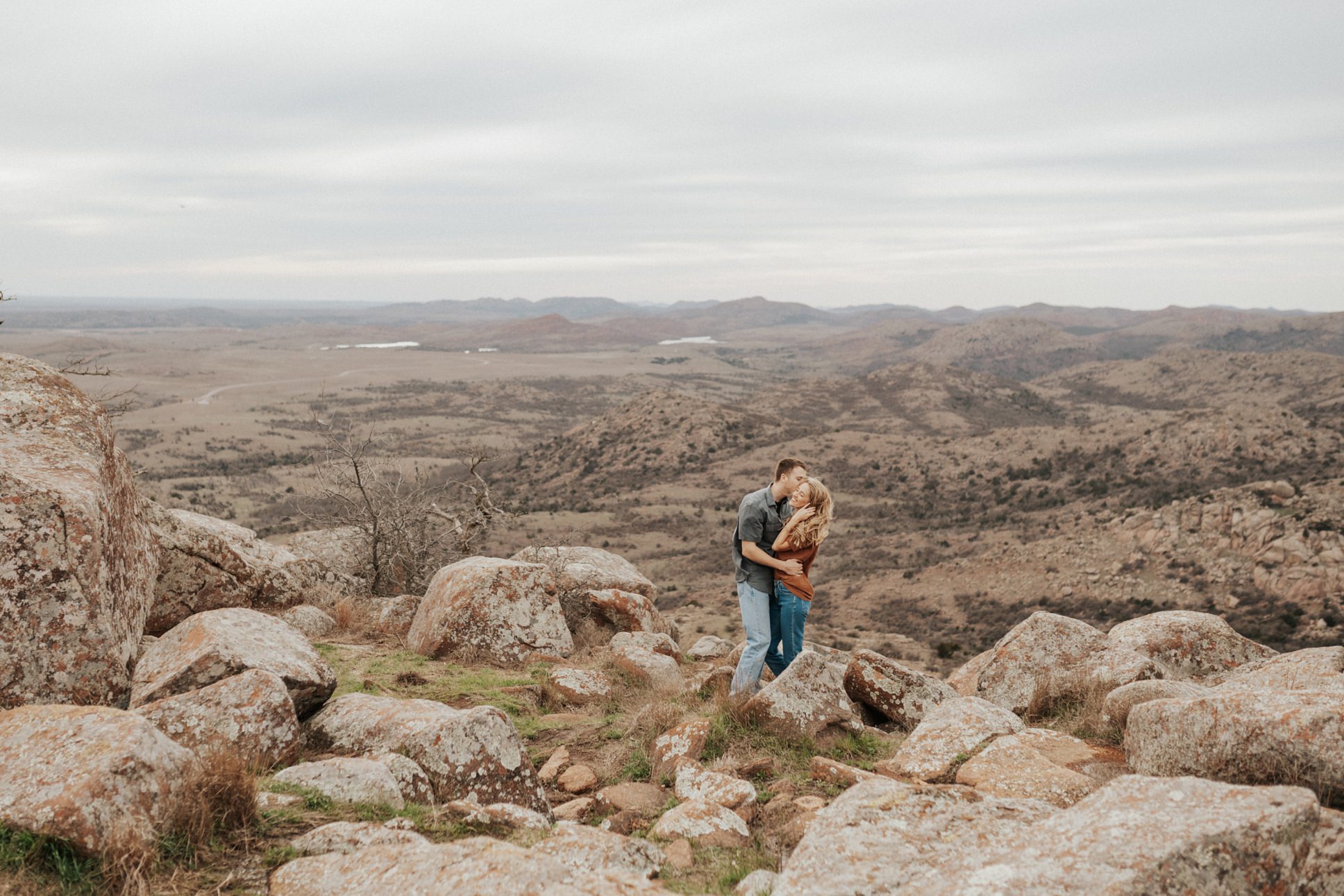A couple at their session at the top of Mount Scott, taken by Angie Willis Photography.