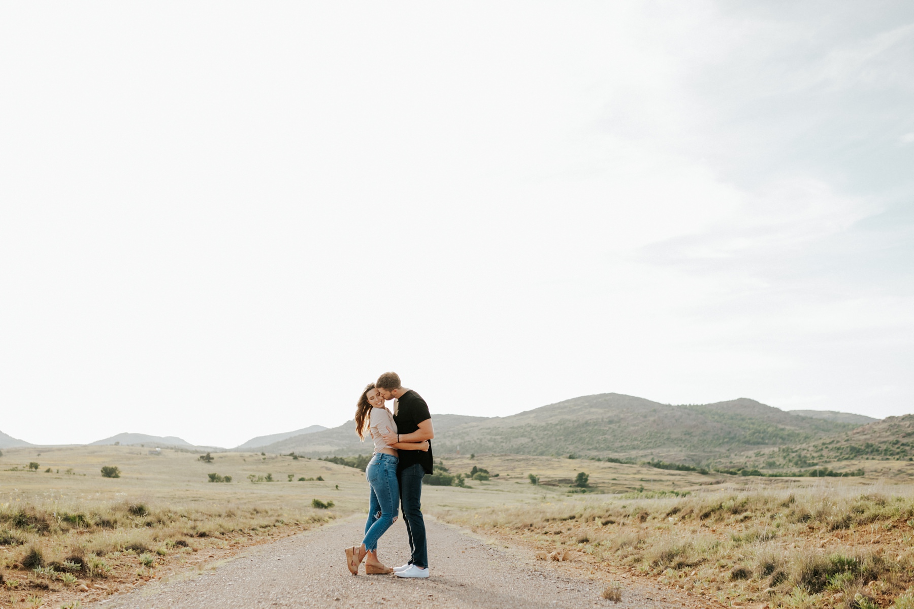 A couple hugging in the Wichita Mountains.