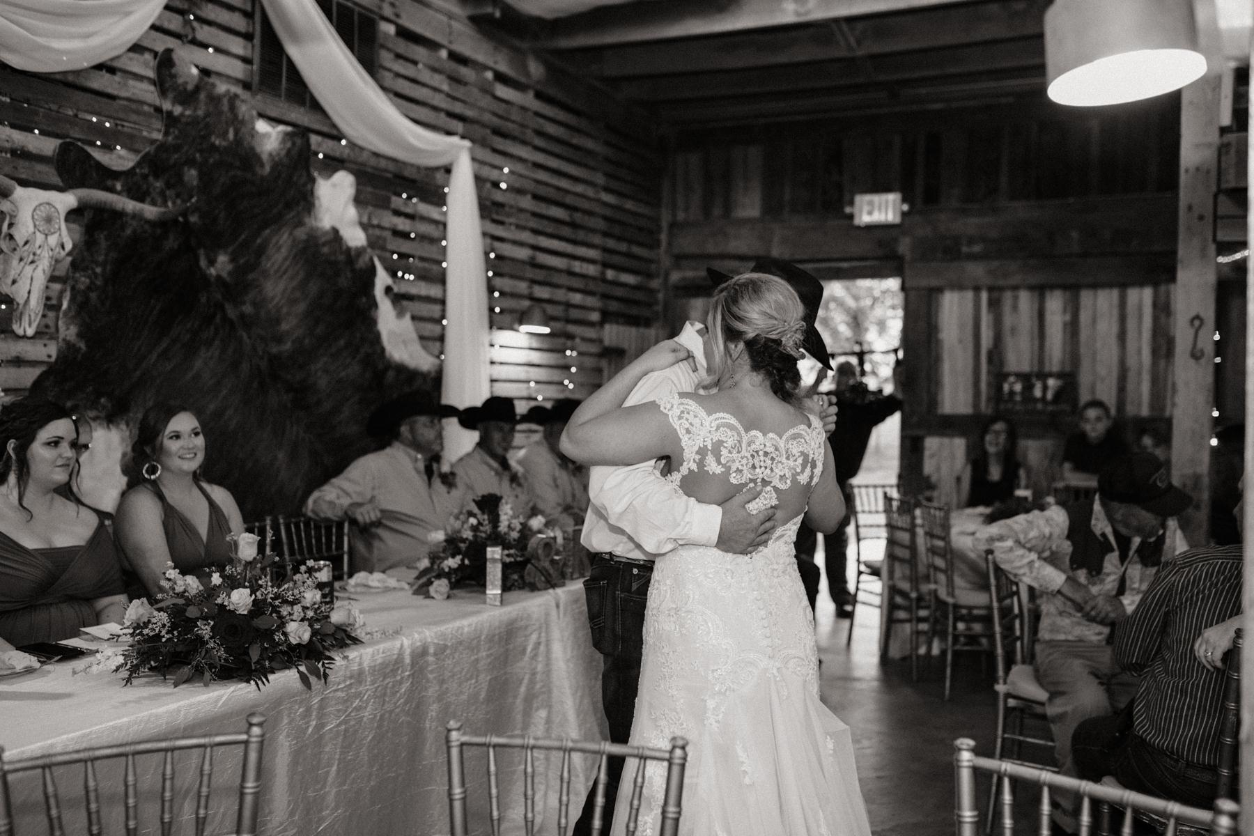 A bride and grooms first dance at their wedding at The Barn at Belamour in Springfield, MO.